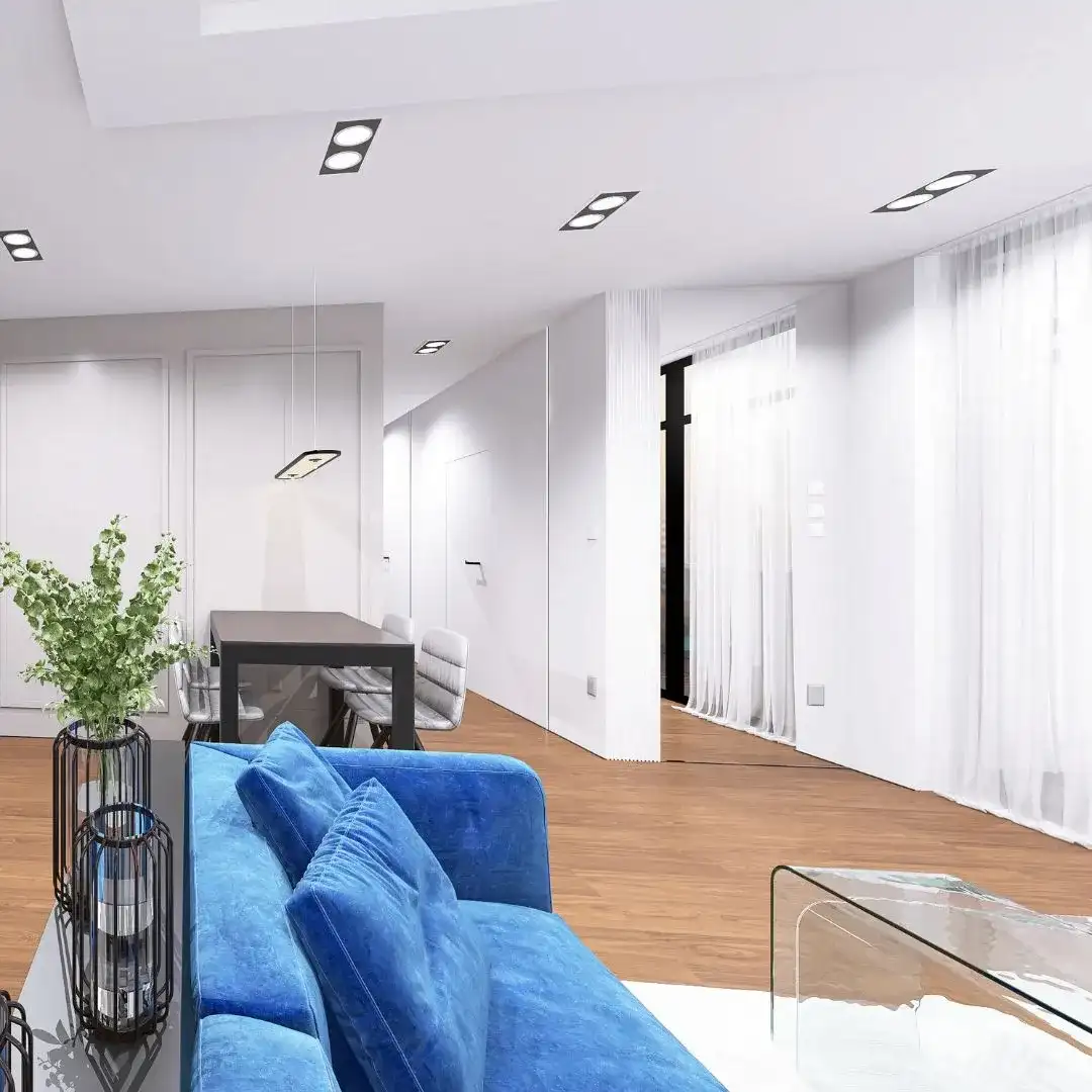 jasny-salon-nowoczesny-styl-bydgoszcz-projektant Jasny salon z niebieską kanapą i eleganckimi dodatkami, stylowe urządzanie apartamentu w Bydgoszczy