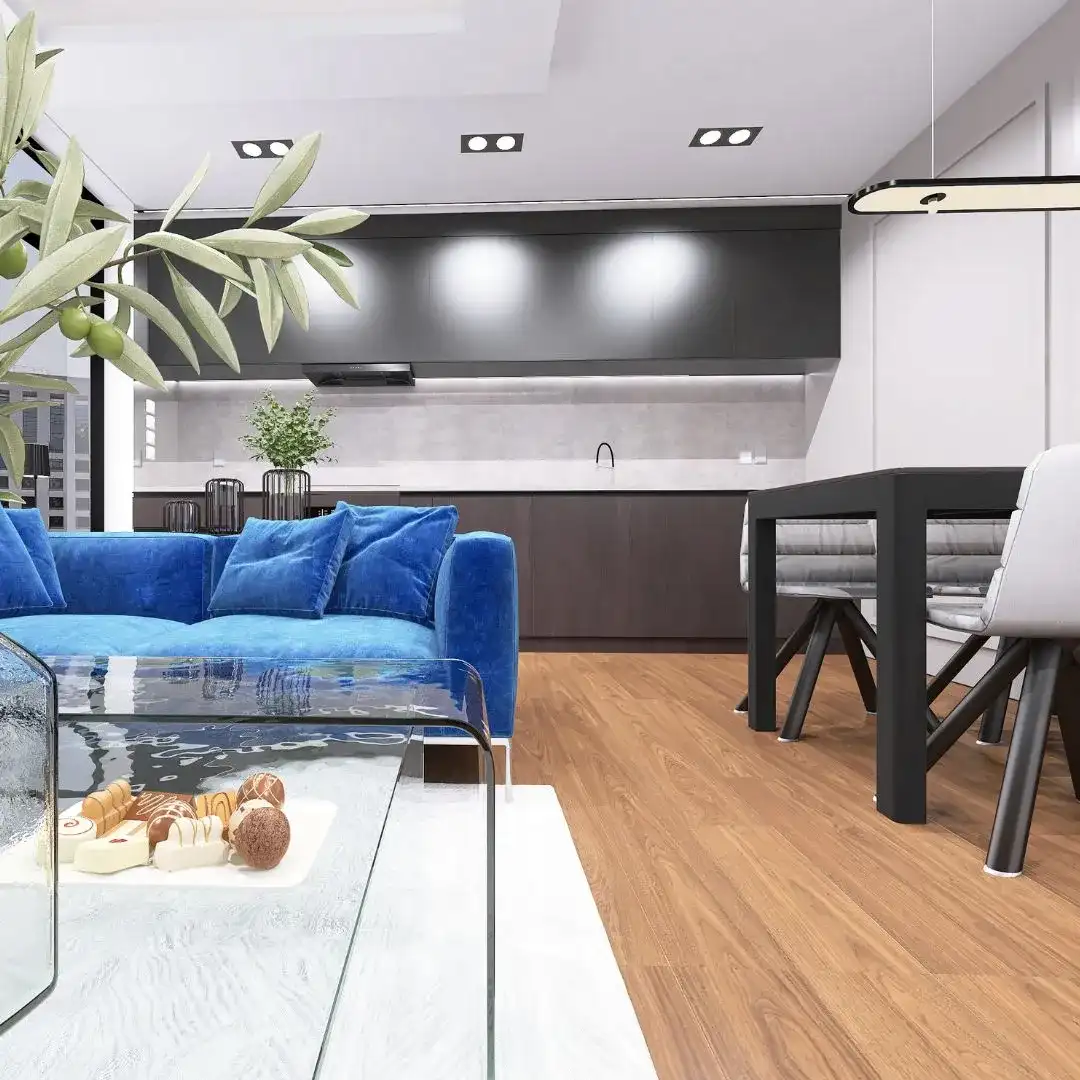 niebieska-kanapa-drewniana-podloga-bydgoszcz Salon z niebieską kanapą, szklanym stolikiem i drewnianą podłogą, tworzenie wnętrz Bydgoszcz